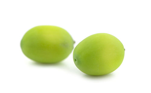 Close-up of green apple against white background