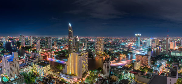 High angle view of illuminated city buildings at night