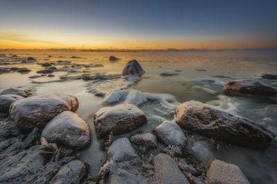 Scenic view of sea against sky during sunset
