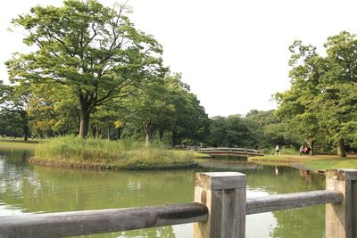 Scenic view of lake in park against clear sky