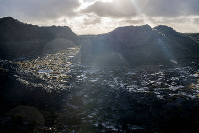 Aerial view of mountains against sky