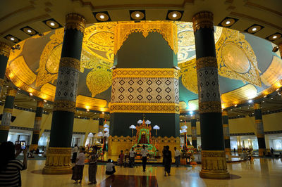 Group of people in illuminated building