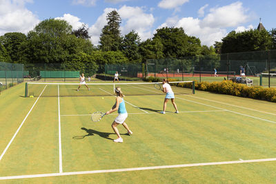 Mature women during a tennis match on grass court