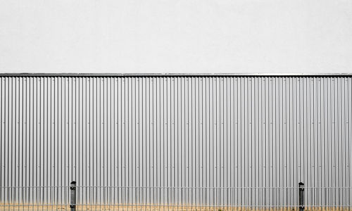 Corrugated iron against wall