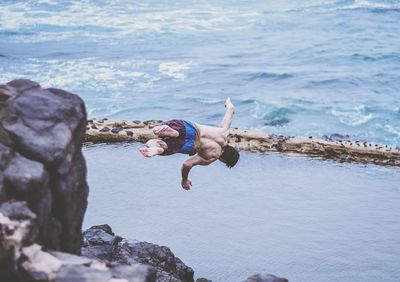 Man jumping in sea