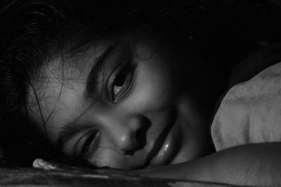 Close-up portrait of cute girl at home