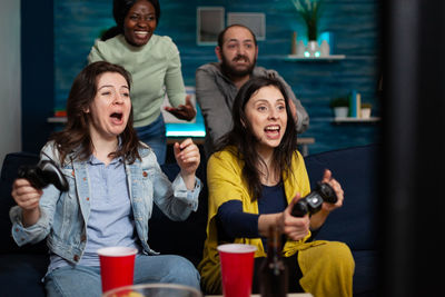 Portrait of smiling friends in cafe