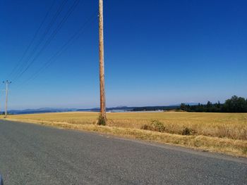 Country road against blue sky