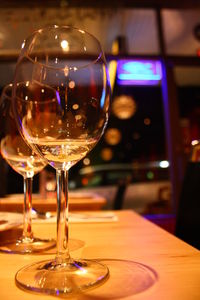 Close-up of wine glasses on table