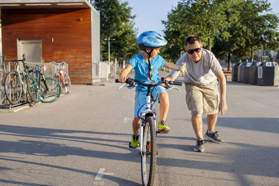 Man riding bicycle on street
