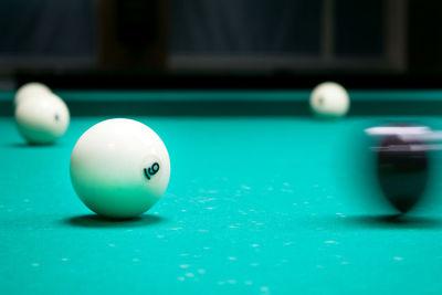 Close-up of pool ball on pool table