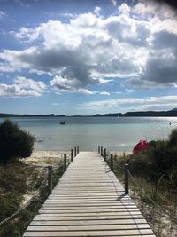 Pier over sea against sky