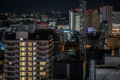 Illuminated buildings in city at night