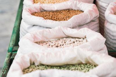 Sacks of legumes in a market stall
