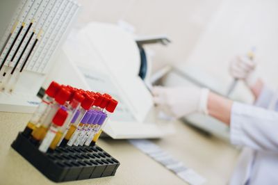 Close-up of test tube rack on table in laboratory