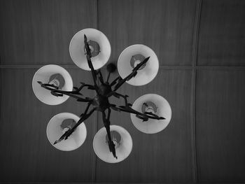 Directly above shot of illuminated electric lamp on wall
