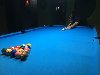 Man playing with ball on table
