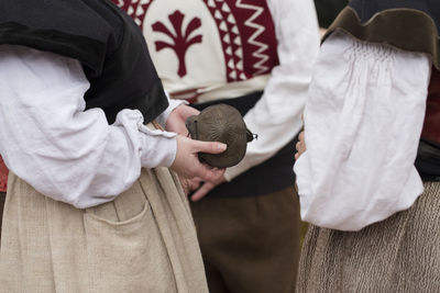 Rear view of people holding hands