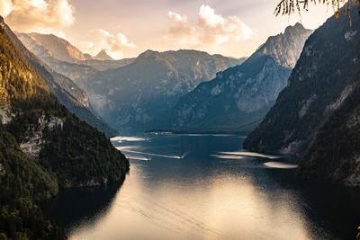 Scenic view of river amidst mountains against sky