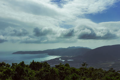 Scenic view of sea against storm clouds