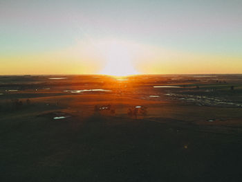 Scenic view of sunset over land