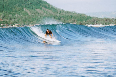 Man surfing in sea