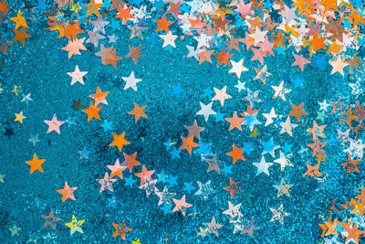 Full frame shot of multi colored star shapes on wall