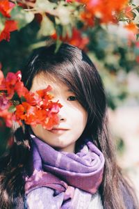 Close-up portrait of woman with flowers