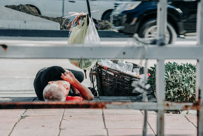Homeless man sleeps on the street , bangkok thailand.the poor man