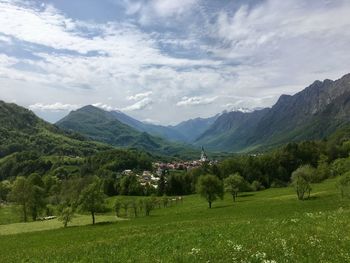 Scenic view of landscape and mountains against sky