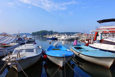 Boats moored at harbor