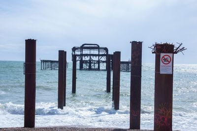 Pier over sea against sky