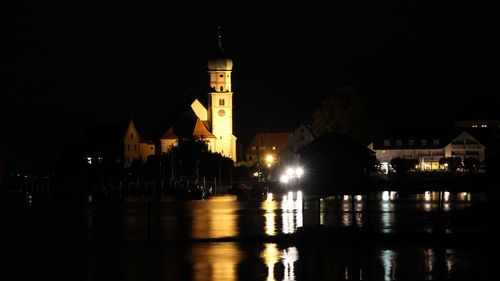 Illuminated buildings in city at night