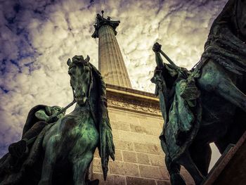 Low angle view of statue against sky