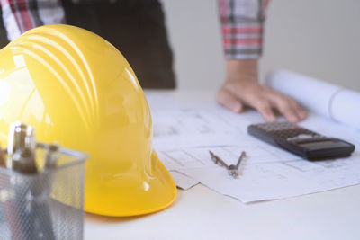 Close-up of man working on table