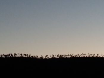 View of silhouette landscape against clear sky