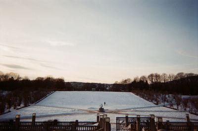 Scenic view of snow covered landscape against sky