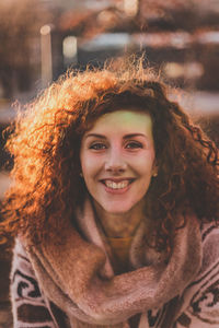 Close-up portrait of smiling woman in warm clothing
