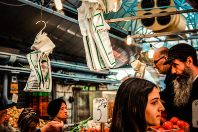 Low angle view of people at market stall