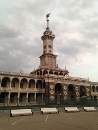 Low angle view of building against cloudy sky