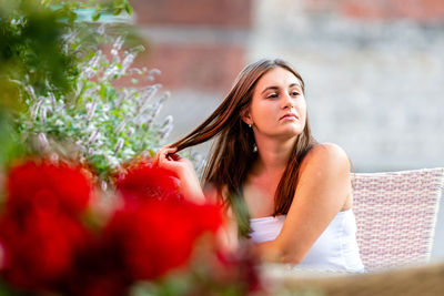 Young woman looking away outdoors