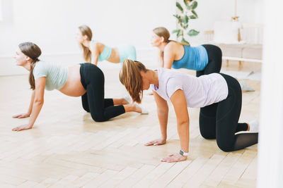 Group of people relaxing on floor