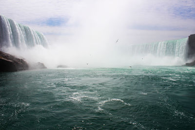 Waterfall with lake in foreground