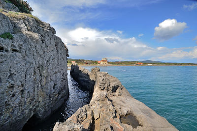 A stretch of tagliata etrusca, in mediterranean sea. a canal dug into the cliff