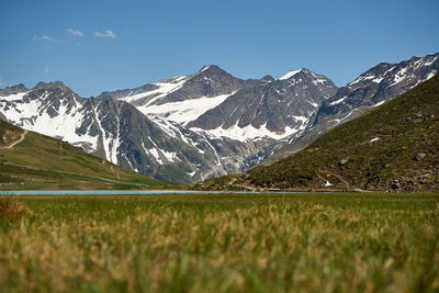 Scenic view of snowcapped mountains against sky