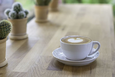 Close-up of coffee cup on table