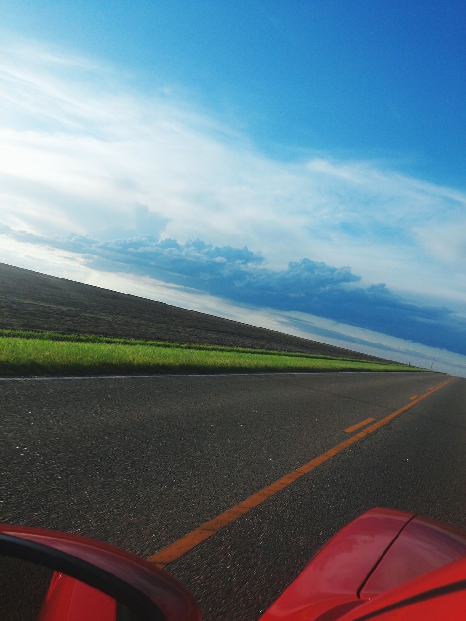 transportation, road, road marking, sky, mode of transport, landscape, car, land vehicle, scenics, tranquil scene, cloud - sky, tranquility, country road, beauty in nature, travel, nature, mountain, cloud, street, the way forward