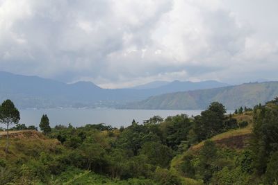 Scenic view of landscape and mountains against sky