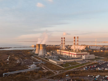 Thermal power plant on sunset. heat generation for heating on cold days, environmental pollution. 