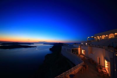 View of illuminated city at sunset